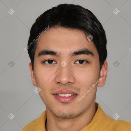 Joyful asian young-adult male with short  black hair and brown eyes