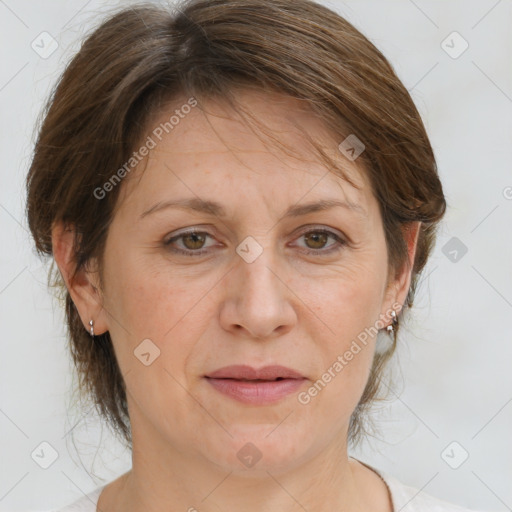 Joyful white adult female with medium  brown hair and grey eyes