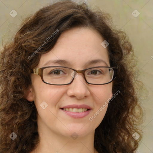 Joyful white adult female with long  brown hair and green eyes