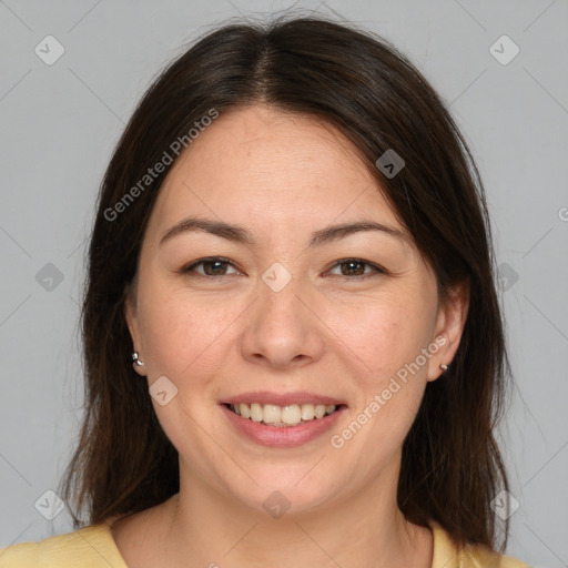 Joyful white adult female with medium  brown hair and brown eyes