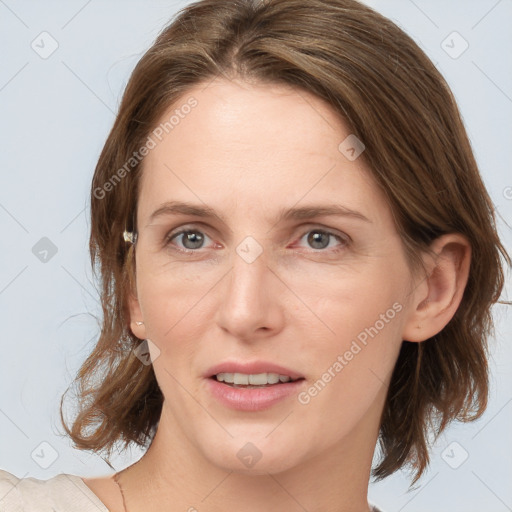 Joyful white young-adult female with medium  brown hair and grey eyes