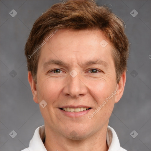 Joyful white adult male with short  brown hair and grey eyes