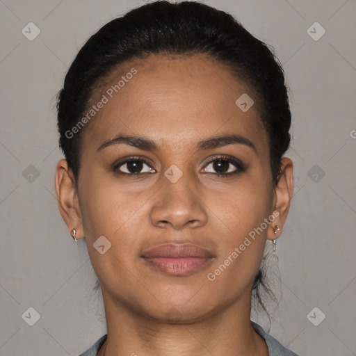 Joyful black young-adult female with short  black hair and brown eyes
