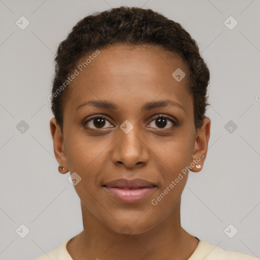 Joyful black young-adult female with short  brown hair and brown eyes