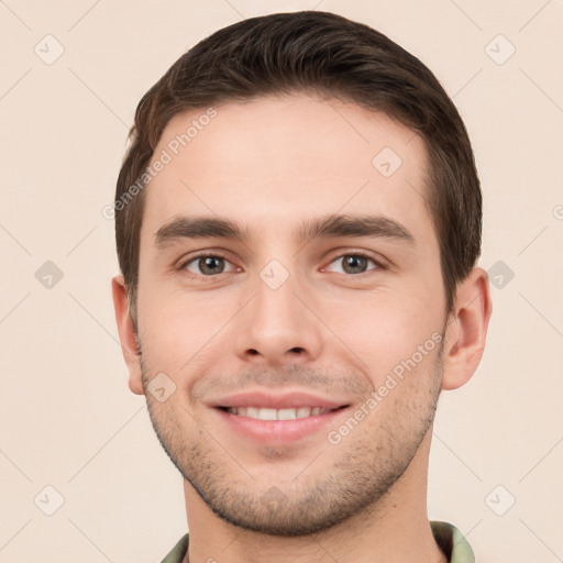 Joyful white young-adult male with short  brown hair and brown eyes