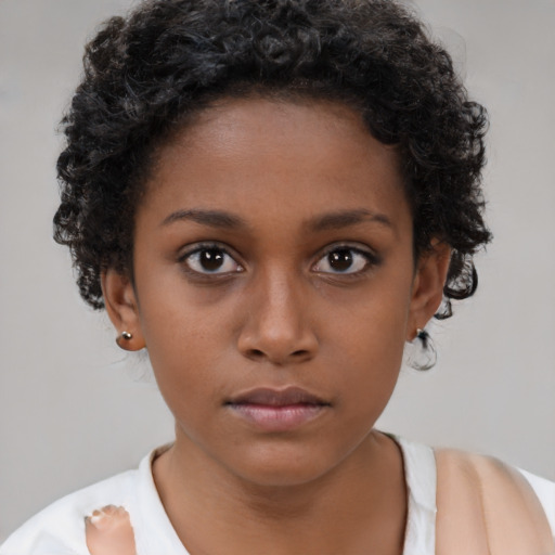 Neutral black young-adult female with short  brown hair and brown eyes