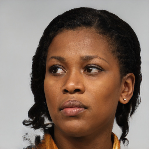 Neutral black young-adult female with medium  black hair and brown eyes