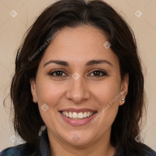 Joyful white adult female with long  brown hair and brown eyes