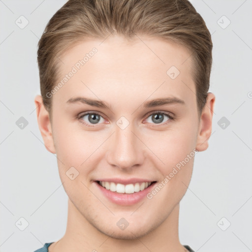 Joyful white young-adult female with short  brown hair and grey eyes