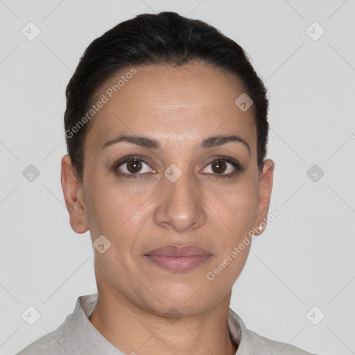 Joyful latino young-adult female with short  brown hair and brown eyes