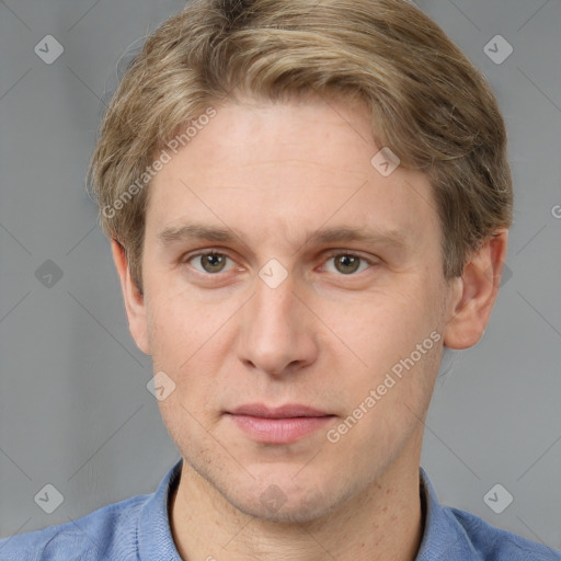 Joyful white adult male with short  brown hair and grey eyes