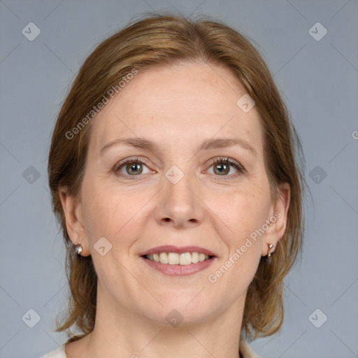 Joyful white adult female with medium  brown hair and grey eyes