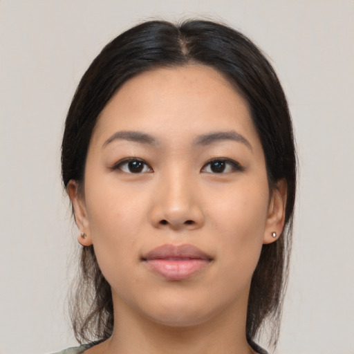 Neutral latino young-adult female with medium  black hair and brown eyes