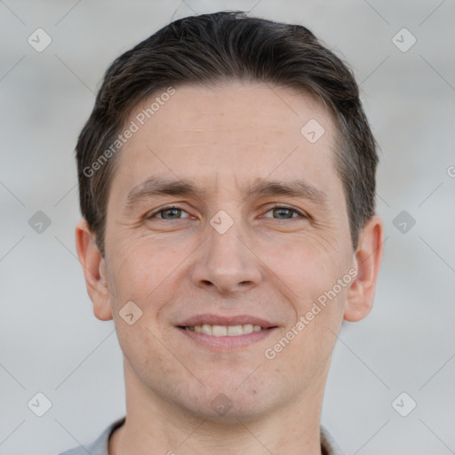 Joyful white adult male with short  brown hair and brown eyes