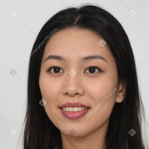 Joyful asian young-adult female with long  brown hair and brown eyes