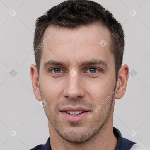 Joyful white young-adult male with short  brown hair and brown eyes