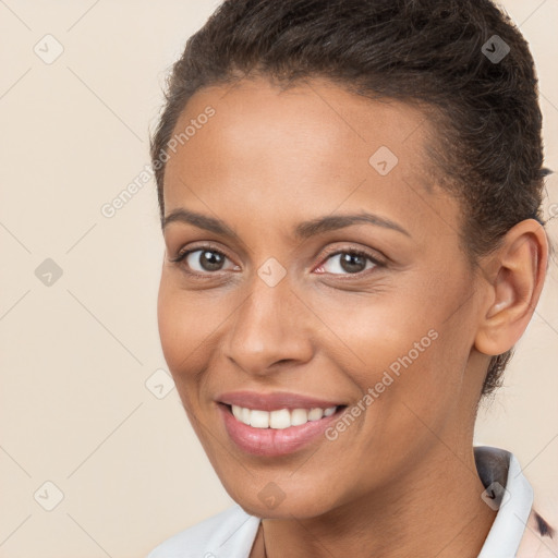 Joyful white young-adult female with short  brown hair and brown eyes