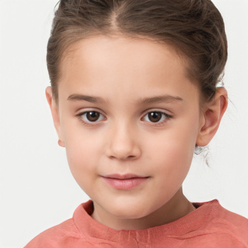 Joyful white child female with short  brown hair and brown eyes