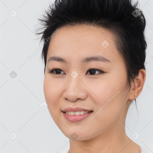 Joyful asian young-adult female with short  black hair and brown eyes