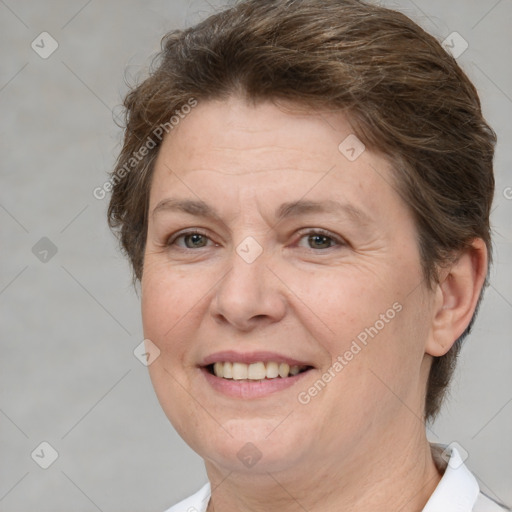 Joyful white adult female with short  brown hair and brown eyes