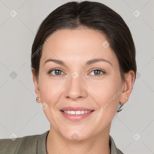 Joyful white adult female with short  brown hair and brown eyes