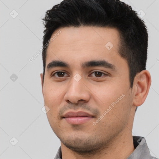 Joyful latino young-adult male with short  black hair and brown eyes