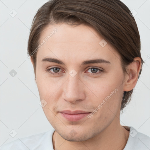 Joyful white young-adult female with short  brown hair and brown eyes