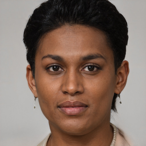 Joyful latino young-adult female with short  black hair and brown eyes