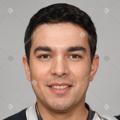 Joyful white young-adult male with short  black hair and brown eyes