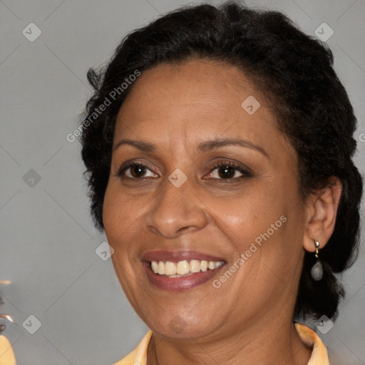 Joyful black adult female with medium  brown hair and brown eyes