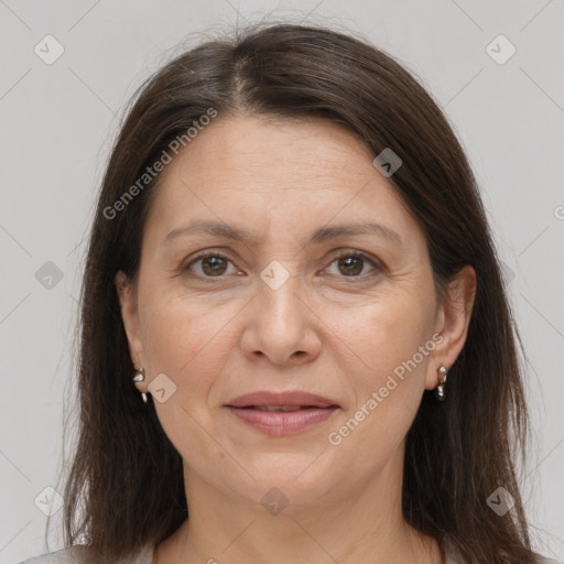 Joyful white adult female with medium  brown hair and grey eyes