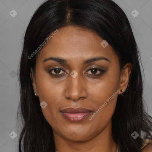 Joyful black young-adult female with long  brown hair and brown eyes