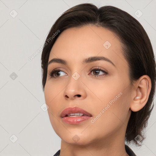 Neutral white young-adult female with medium  brown hair and brown eyes