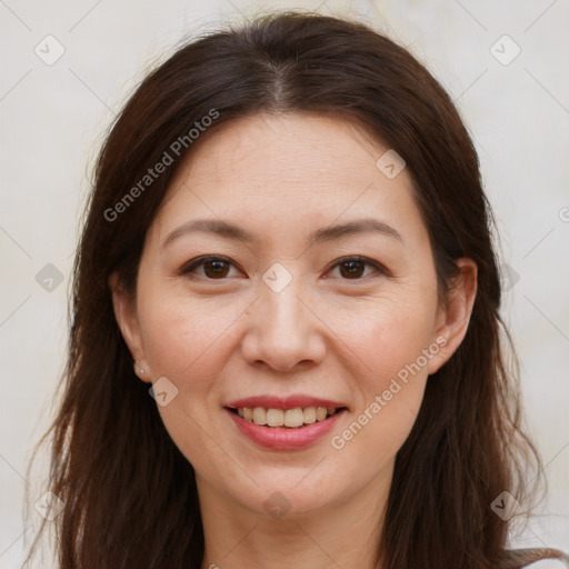 Joyful white adult female with long  brown hair and brown eyes