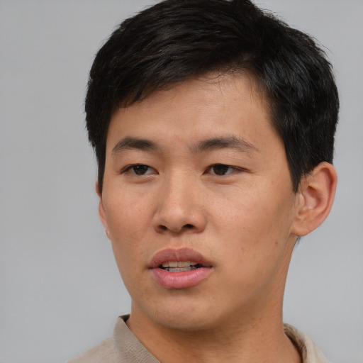 Neutral asian young-adult male with short  brown hair and brown eyes