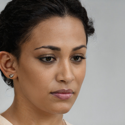 Neutral latino young-adult female with short  brown hair and brown eyes
