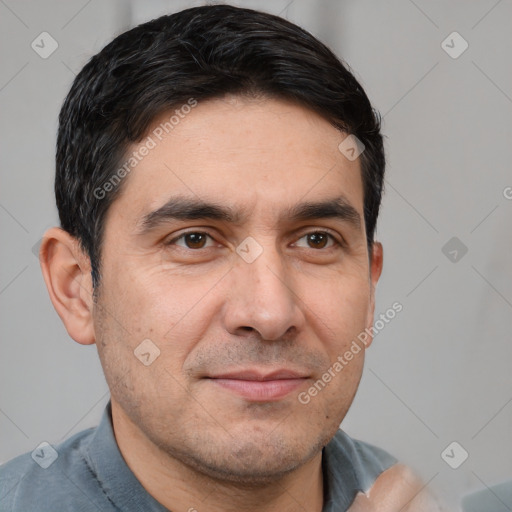 Joyful white young-adult male with short  black hair and brown eyes