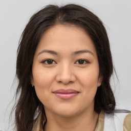 Joyful asian young-adult female with medium  brown hair and brown eyes