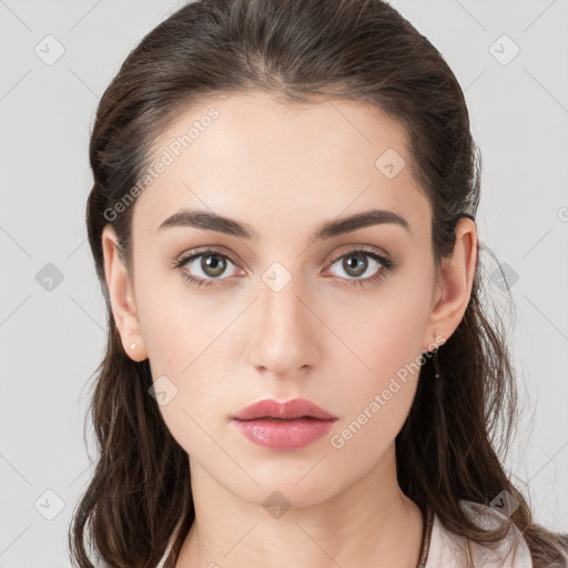 Neutral white young-adult female with long  brown hair and brown eyes