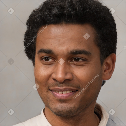 Joyful latino adult male with short  black hair and brown eyes