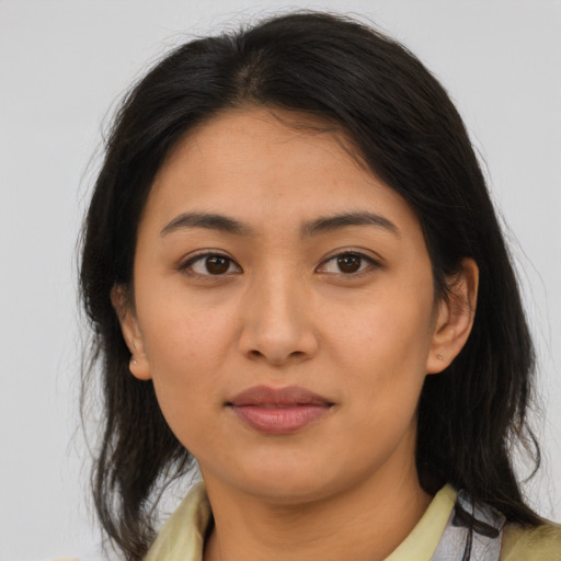 Joyful asian young-adult female with medium  brown hair and brown eyes
