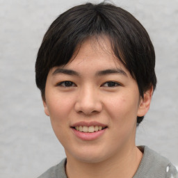 Joyful asian young-adult female with short  black hair and brown eyes