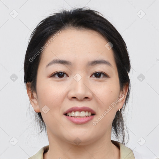 Joyful asian young-adult female with medium  black hair and brown eyes