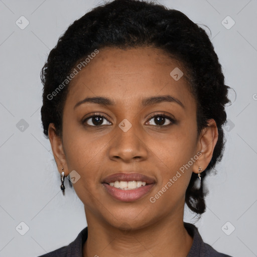 Joyful black young-adult female with short  black hair and brown eyes