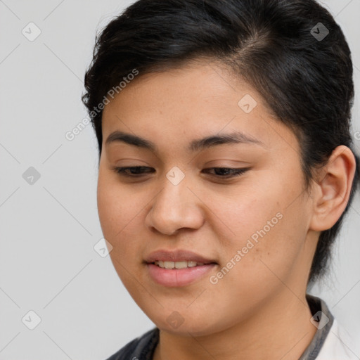 Joyful latino young-adult female with medium  brown hair and brown eyes