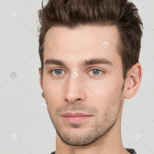 Neutral white young-adult male with short  brown hair and brown eyes