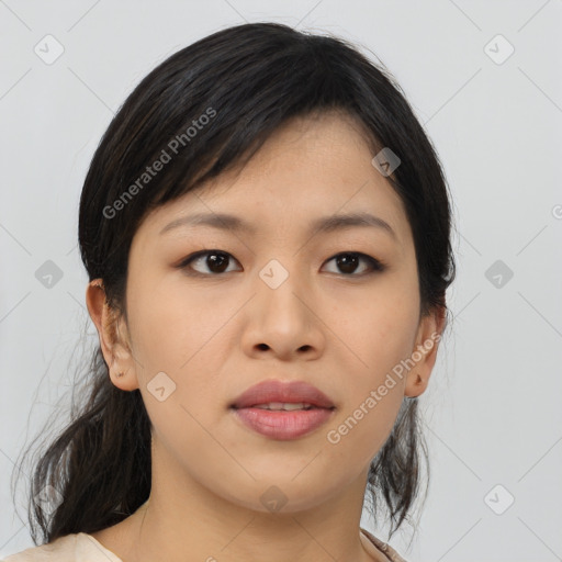 Joyful asian young-adult female with medium  black hair and brown eyes