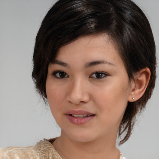 Joyful white young-adult female with medium  brown hair and brown eyes