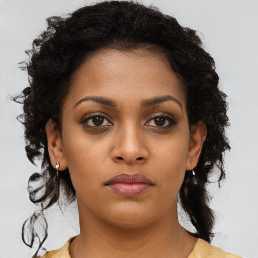 Neutral black young-adult female with long  brown hair and brown eyes