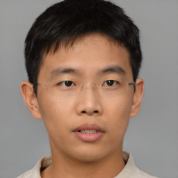 Neutral asian young-adult male with short  brown hair and brown eyes
